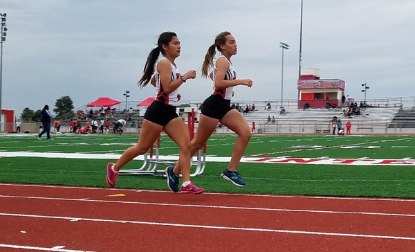 Emiliana Merida and Genesis Obispo, members of Elsinore's Varsity team, during the 2 mile race.  