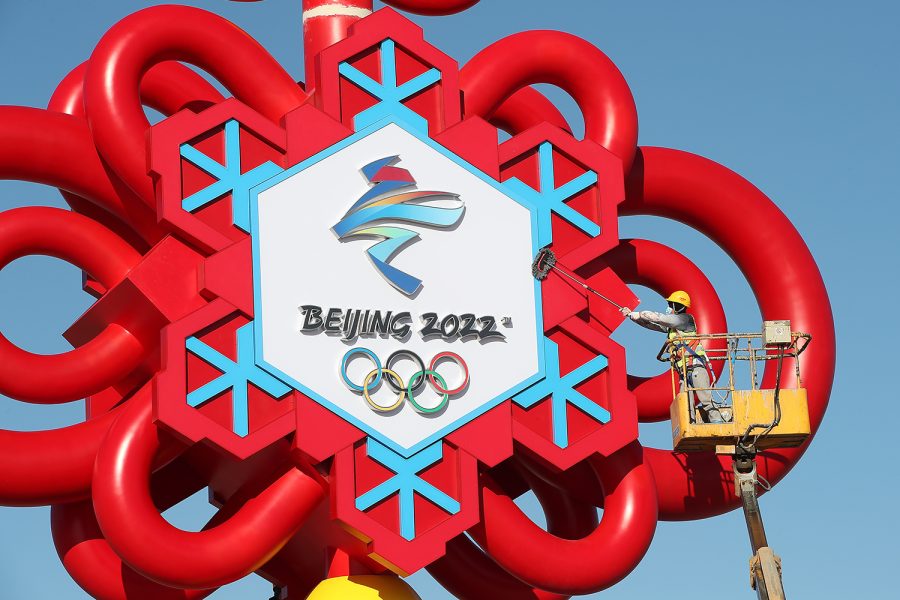 BEIJING, CHINA - JANUARY 13: A worker clears the Winter Olympics-themed Chinese knot installation at Tiananmen Square on January 13, 2022 in Beijing, China. (Photo by Wang Xin/VCG via Getty Images)