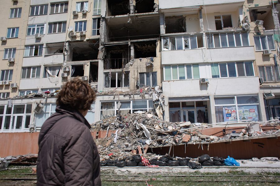 A resident whose apartment got destroyed as a result of a missile strike on a residential building, looks at the work of the rescue team on April 25, 2022, in Odessa, Ukraine. Ukrainian forces, as well as civilian Odessans, remain on guard against a potential Russian advance on this historic port city, whose capture could help give Russia control of Ukraines southern coast. But given Russias setbacks in this two-month-long war, including the sinking of its Black Sea Fleets flagship Moskva, analysts regard a full-scale attack on Odessa to be unlikely. (Anastasia Vlasova/Getty Images/TNS)
