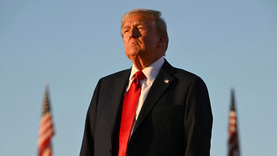 TOPSHOT - Former US President and Republican presidential candidate Donald Trump looks on during a campaign rally at site of his first assassination attempt in Butler, Pennsylvania on October 5, 2024. (Photo by Jim WATSON / AFP)